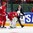 MINSK, BELARUS - MAY 20: Vitali Koval #1 of Belarus is helped off the ice by Roman Graborenko #92 and team doctor Gennadi Zagrorodny after getting injured during the second period of preliminary round action against Russia at the 2014 IIHF Ice Hockey World Championship. (Photo by Andre Ringuette/HHOF-IIHF Images)

